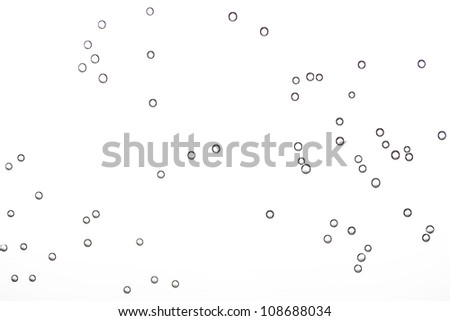 Air bubbles underwater on white background