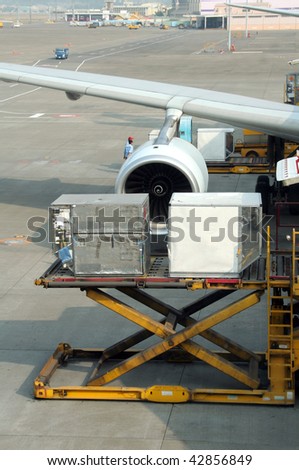 Loading cargo to a commercial airplane