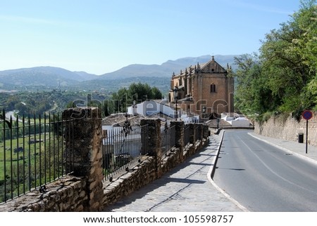 View down Calle Santa Cecilia towards the Holy Ghost church, Ronda, Andalusia, Western Europe.