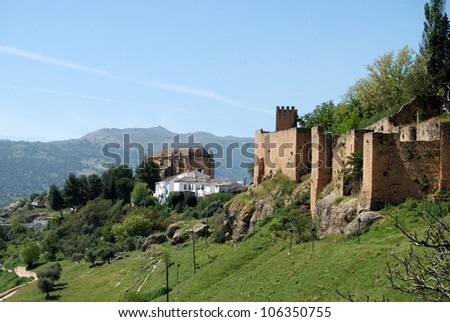 View along the old town wall towards the The Holy Ghost church (Iglesia del Espiritu Santo), Ronda, Andalusia, Western Europe.