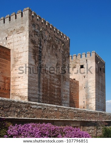 Cistern Court (Plaza de los Aljibes), East side of the castle with pink tree blossom in foreground, Palace of Alhambra, Granada, Granada Province, Andalucia, Spain, Western Europe.