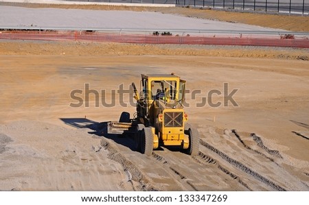 Earthmover flattening ground at the airport, Malaga, Andalusia, Spain, Western Europe.
