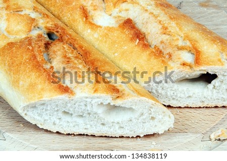 Baguette cut in half on a chopping board, Andalucia, Spain, Western Europe.