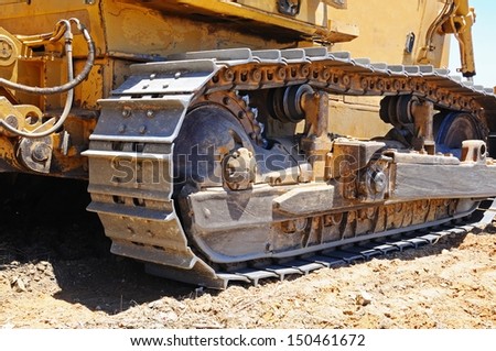 Detail of the continuous tracked tractor tracks on a yellow bulldozer, Costa del Sol, Andalusia, Spain, Western Europe.