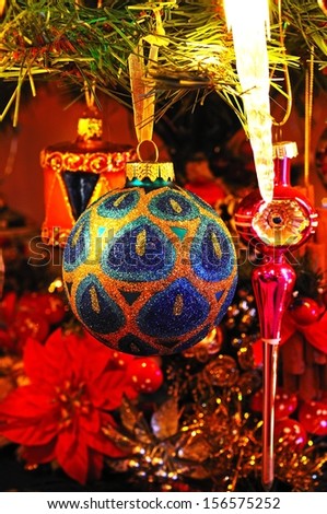 Colourful glass Christmas globes hanging on a Christmas tree, England, UK, Western Europe.