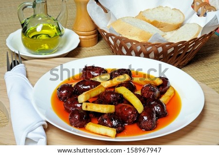 Mini chorizo sausages and chipped potatoes in olive oil tapas, Costa del Sol, Malaga Province, Andalucia, Spain, Western Europe.