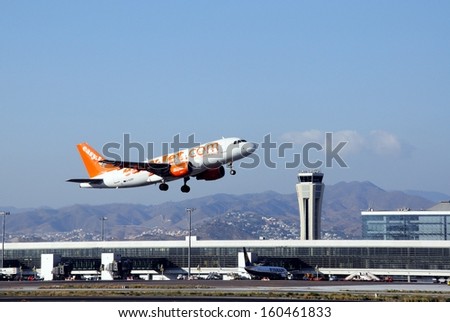 MALAGA, SPAIN - SEPTEMBER 4, 2010 - Easyjet Airbus A319 taking off from Malaga airport with the undercarriage down, Malaga, Spain, September 4, 2010.