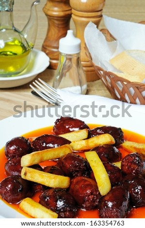 Mini chorizo sausages and chipped potatoes in olive oil tapas, Costa del Sol, Malaga Province, Andalusia, Spain, Western Europe.