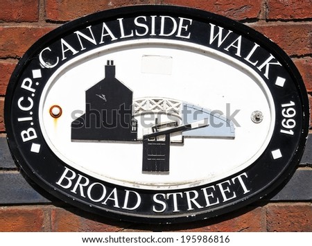 BIRMINGHAM, UNITED KINGDOM - MAY 14, 2014 - Broad Street canalside walk sign against a brick wall, Gas Street Canal Basin, Birmingham, West Midlands, England, UK, Western Europe, May 14, 2014.