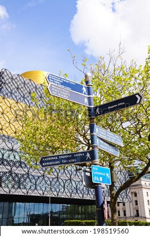 BIRMINGHAM, UNITED KINGDOM - MAY 14, 2014 - Landmark signpost with the Library of Birmingham to the rear, Centenary Square, Birmingham, England, UK, Western Europe, May 14, 2014.