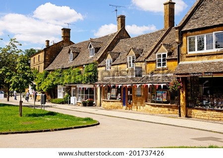 BROADWAY, UK - JUNE 12, 2014 - Tourist shops along the High Street in the centre of the village, Broadway, Cotswolds, Worcestershire, England, UK, Western Europe, June 12, 2014.