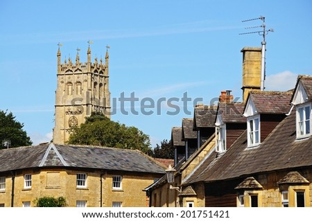 St James church seen over town rooftops, Chipping Campden, The Cotswolds, Gloucestershire, England, UK, Western Europe.