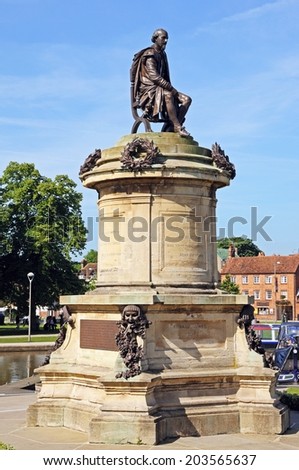 STRATFORD-UPON-AVON, UK - JUNE 12, 2014 - Statue of William Shakespeare sitting on top of the Gower Memorial, Stratford-upon-Avon, Warwickshire, England, UK, Western Europe, June 12, 2014.