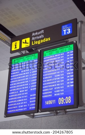 MALAGA, SPAIN - JUNE 14, 2011 - Flight arrival monitors at the arrivals hall in terminal three, Malaga Airport, Malaga, Costa del Sol, Malaga Province, Andalucia, Spain, Western Europe, June 14, 2011.