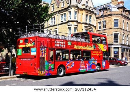 Oxford, United Kingdom - June 17, 2014 - Red open topped Oxford tour bus along St Aldates, Oxford, Oxfordshire, England, UK, Western Europe, June 17, 2014.