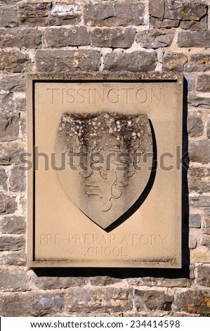 TISSINGTON, UK - SEPTEMBER 7, 2014 - Tissington Hall plaque on the pre-preparatory school building, Tissington, Derbyshire, England, UK, Western Europe, September 7, 2014.