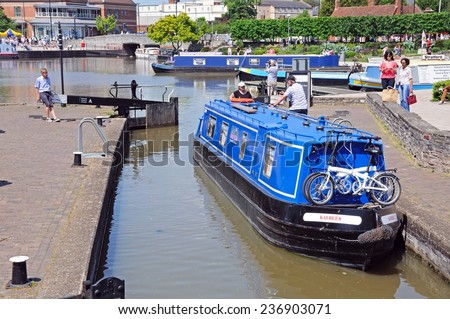 STRATFORD-UPON-AVON, UK - MAY 18, 2014 - Narrowboat in the canal lock, Stratford-Upon-Avon, Warwickshire, England, United Kingdom, Western Europe, May 18, 2014.