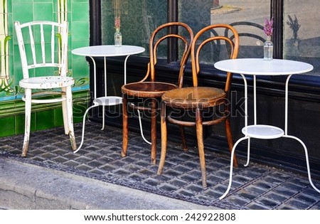 Tables and chairs outside a town centre cafe, Buxton, Derbyshire, England, UK, Western Europe.