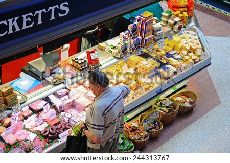 DERBY, UNITED KINGDOM - JULY 17, 2014 - Elevated view of a butchers market stall inside the restored Victorian Market Hall, Derby, Derbyshire, England, UK, Western Europe, July 17, 2014.