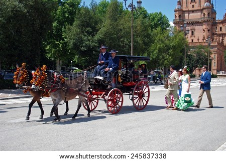 SEVILLE, SPAIN - APRIL 12, 2008 - Horse drawn carriages in the Plaza de Espana, Seville, Seville Province, Andalusia, Spain, Western Europe, April 12, 2008.