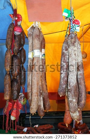 BARBATE, SPAIN - SEPTEMBER 14, 2008 - Chorizo sausages hanging on a market stall at the Medieval market, Barbate, Cadiz Province, Andalusia, Spain, Western Europe, September 14, 2008.