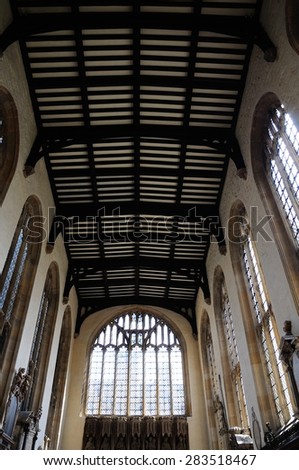 OXFORD, UNITED KINGDOM - JUNE 17, 2014 - Inside view of the University church of St Mary showing the ceiling detail and stained glass window, Oxford, Oxfordshire, England, UK, Europe, June 17, 2014.