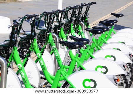 LIVERPOOL, UNITED KINGDOM - JUNE 11, 2015 - Row of city hire bikes for rent along the waterfront at Pier Head, Liverpool, Merseyside, England, UK, Western Europe, June 11, 2015.