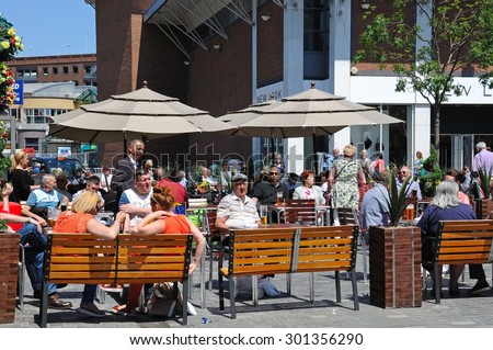 LIVERPOOL, UNITED KINGDOM - JUNE 11, 2015 - People relaxing at a pavement cafe along Whitechapel shoping street in the city centre, Liverpool, Merseyside, England, UK, Western Europe, June 11, 2015.
