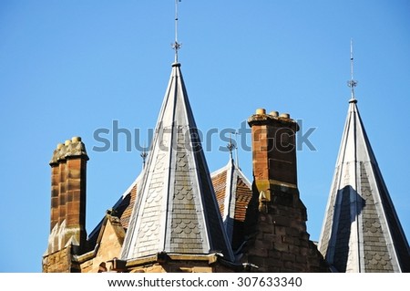 Old school building spires and chimneys at St Mary Priory Gardens, Coventry, West Midlands, England, UK, Western Europe.