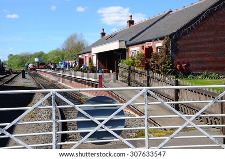 BROWNHILLS, UNITED KINGDOM - APRIL 26, 2015 - View of the station building and railway track Brownhills West Railway Station, Chasewater, West Midlands, England, UK, Western Europe, April 26, 2015.