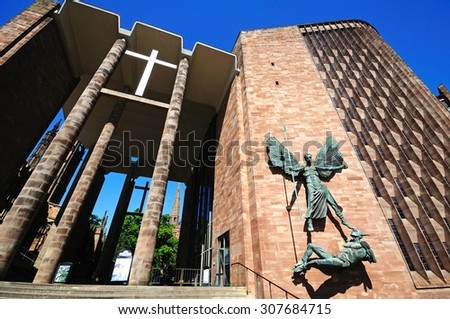 COVENTRY, UNITED KINGDOM - JUNE 4, 2015 - Statue of Michael and the Devil on the wall of the new Cathedral, Coventry, West Midlands, England, UK, Western Europe, June 4, 2015.