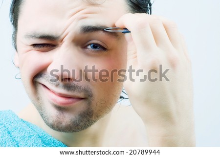 how to pluck eyebrows for men. stock photo : Young men pluck