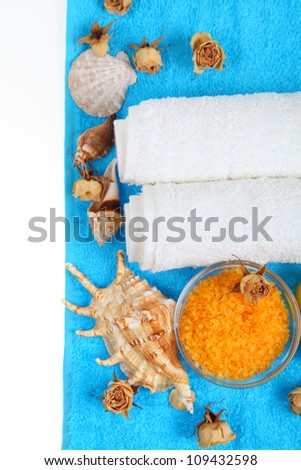 Spa setting with dry roses, sea salt and towels