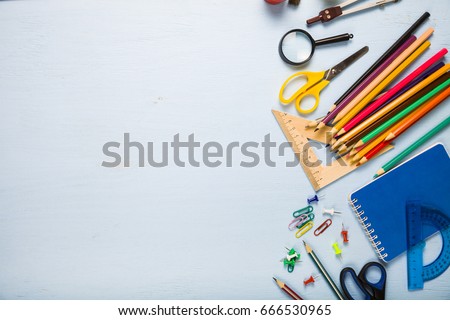 Back to school. Items for the school on a blue wooden table.
