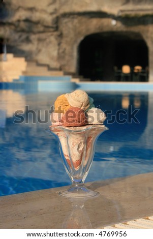 Ice-cream on a background of pool.