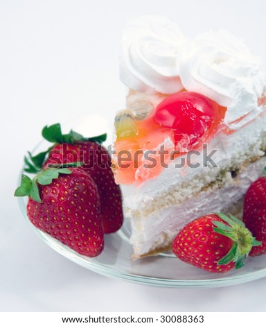 Fancy cake and  strawberry on white background