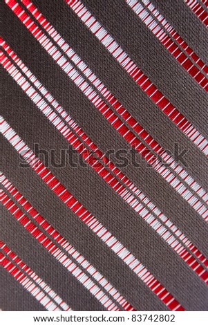 Texture striped fabric, red stripes on a dark background