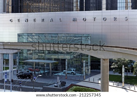 DETROIT JULY 31: People exit the General Motors World Headquarters building located in Detroit, Michigan on July 31, 2014. General Motors is an American multinational automobile corporation.