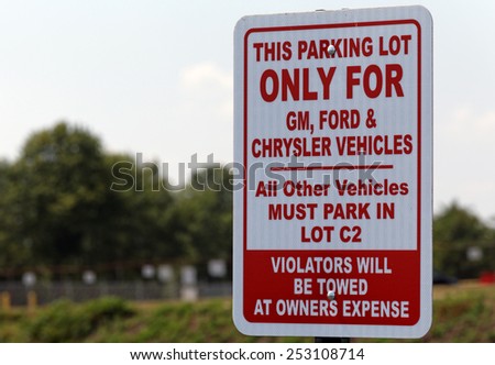 BOWLING GREEN, KY - AUGUST 2: A United Auto Workers parking sign located in Bowling Green, Kentucky on August 2, 2014. The UAW is an American labor union that represents workers in the US and Canada.