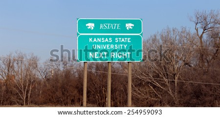 MANHATTAN, KS - FEBRUARY 8: A road sign for Kansas State University in Manhattan, Kansas on February 8, 2015. Kansas State University is a public research university established in 1863.
