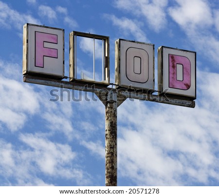 A vintage food sign with one of the letters broken out