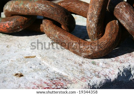 Industrial Chains in cement block at the harbour