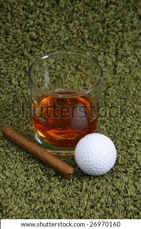 Whiskey and Cigar with a golf ball after the game