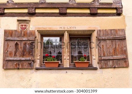Old European Wooden Window Shutters and Flower Window Boxes
