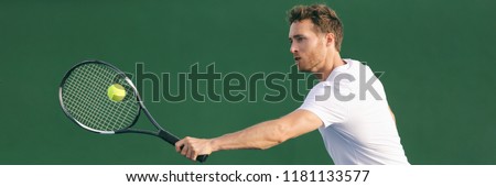 Tennis player hitting ball with backhand racket on hard court. Man playing game returning ball on panorama banner. Sports and fitness active lifestyle.