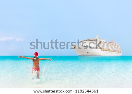 Cruise ship Christmas New Year winter holidays travel Caribbean vacation woman on summer holidays swimming in blue ocean water. Happy bikini girl running with open arms in success enjoying tropics.