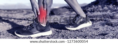 Medical health injury runner woman with hurting twisted ankle. Sports injury fitness athlete with red inflamed pain. Panorama banner.
