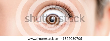 Hypnosis therapy for ocd mental help problems. Closeup of eye with graphic spiral design over eyes of woman hypnotized banner panorama. Asian girl hypnose portrait background.