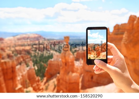 Smartphone camera phone taking photo picture of Bryce Canyon nature. Closeup of mobile phone camera screen photographing beautiful american landscape Bryce Canyon, Utah, USA.
