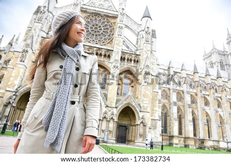 Westminster Abbey church London with young woman professional or tourist, England, Great Britain, UK.